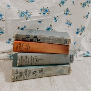 four (4) vintage books